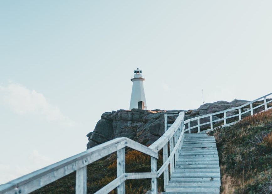 white wooden staircase on top of hill